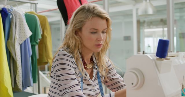 Young Fashion Designer Using Sewing Machine in Studio - Download Free Stock Images Pikwizard.com