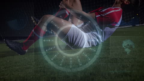 Data Overlay on Injured Soccer Player in Stadium at Night
