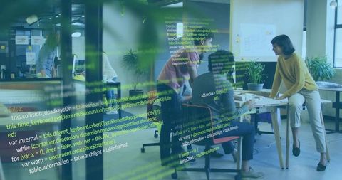 Cross-functional team collaborating around prototype table with virtual code overlay