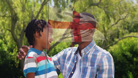 Father and Son Embracing with Superimposed England Flag