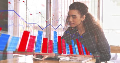 Businesswoman Analyzing Data with Overlayed Graphs in Modern Office