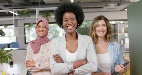 Diverse Businesswomen Team Achieving Success in Modern Office