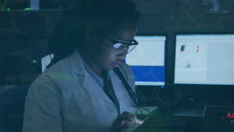 Scientist Analyzing Data on Tablet in Laboratory Environment