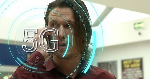 5G Technology Overlay with Businessman in Office