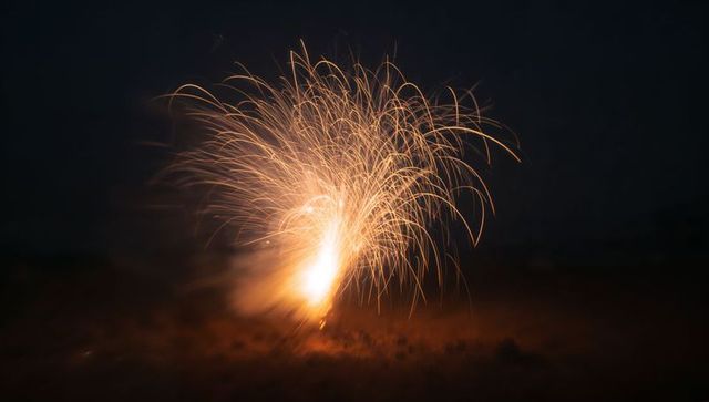 Erupting fountain firework in night sky
