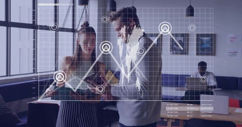 Data-driven team collaborating with tablet and analytics overlay in modern coworking space