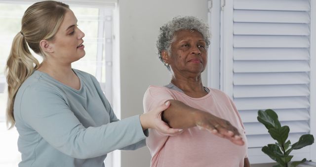 Physical Therapist Assisting Senior Woman During Rehabilitation Exercise Session - Download Free Stock Images Pikwizard.com