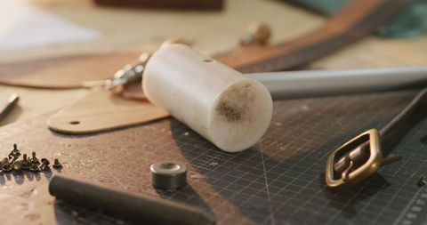 Crafting tools on workshop table for leatherworking