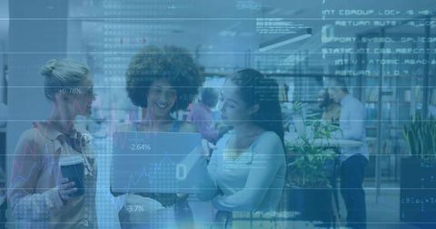 Women Collaborating on Laptop in Modern Office with Digital Overlay