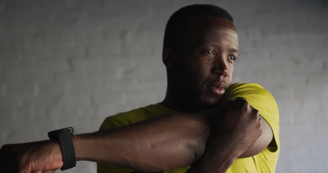 Focused Athlete Stretching Arm During Workout - Download Free Stock Images Pikwizard.com