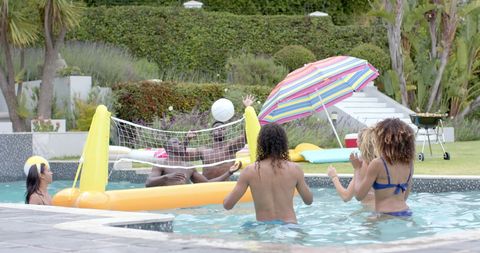 Friends Playing Volleyball at Outdoor Pool Party - Download Free Stock Images Pikwizard.com
