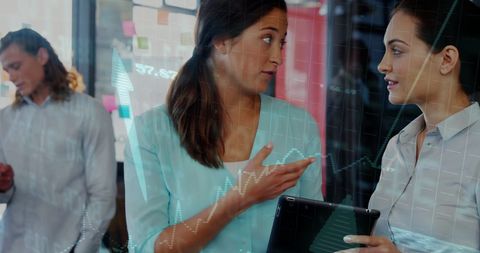 businesswomen analyzing data with virtual financial graph overlay - Download Free Stock Images Pikwizard.com