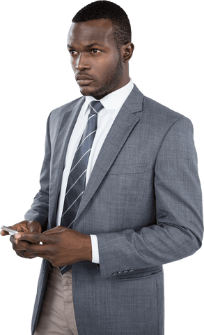 Young African American businessman in suit and tie standing confidently while holding a mobile phone on transparent background. Ideal for technology, commercial, or business-related content, this image emphasizes modern communication and professionalism in the workplace.