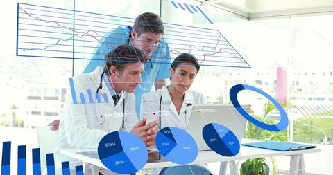 Medical team reviewing clinical data with augmented reality charts and laptop