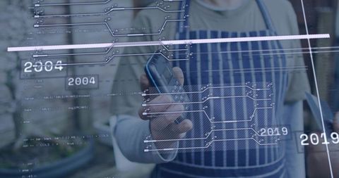 Vendor processing mobile contactless card payment with AR data overlay and tablet in market courtyar