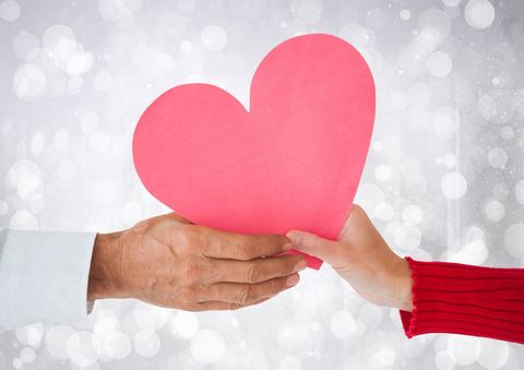 Helping Hands Holding Paper Heart Symbol of Love and Unity - Download Free Stock Templates Pikwizard.com