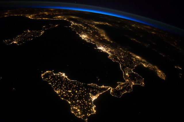 ISS040-E-080962 (26 July 2014) --- One of the Expedition 40 crew members aboard the International Space Station photographed this oblique night image of almost the entire countries of Italy and Sicily on July 26, 2014.
