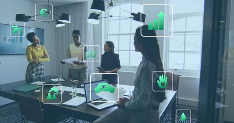Diverse Female Team Discussing Reports with Innovative Eco Tech Overlay - Download Free Stock Images Pikwizard.com