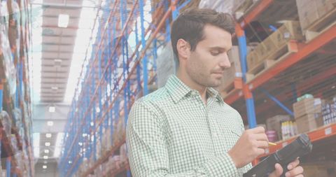 Warehouse Worker Using Digital Tablet with Data Overlay