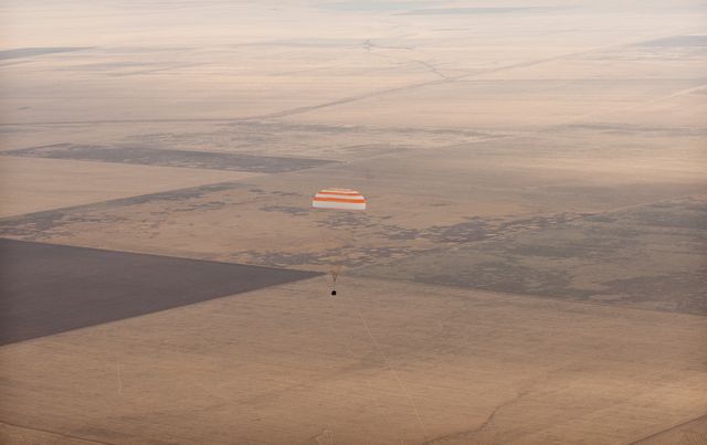 The Soyuz TMA-18 spacecraft is seen as it lands with Expedition 24 Commander Alexander Skvortsov and Flight Engineers Tracy Caldwell Dyson and Mikhail Kornienko near the town of Arkalyk, Kazakhstan on Saturday, Sept. 25, 2010.  Russian Cosmonauts Skvortsov and Kornienko and NASA Astronaut Caldwell Dyson, are returning from six months onboard the International Space Station where they served as members of the Expedition 23 and 24 crews. Photo Credit: (NASA/Bill Ingalls)