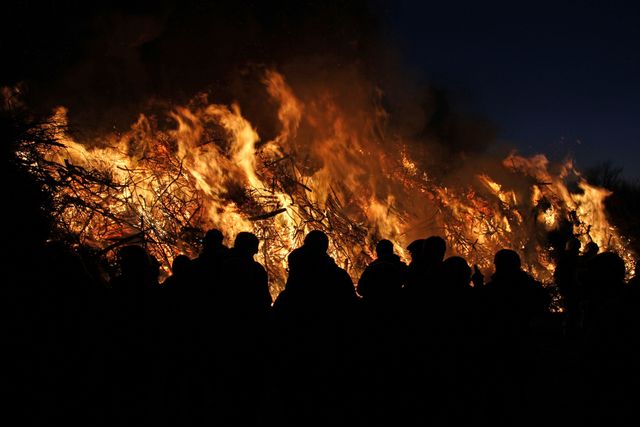Group of People Watching Large Bonfire at Night - Download Free Stock Photos Pikwizard.com