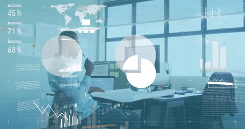 Businessman in Office Analyzing Financial Data with Modern Interface