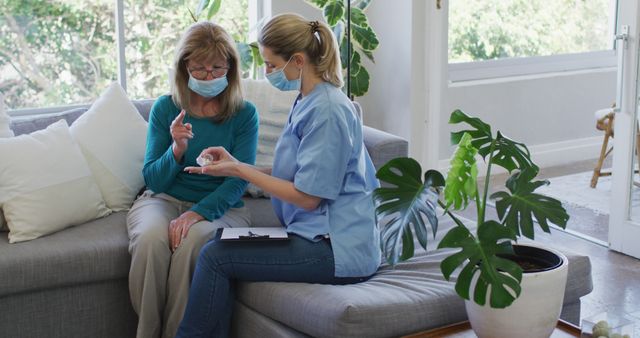 Senior Woman in Mask Consulting with Caring Nurse at Home - Download Free Stock Images Pikwizard.com