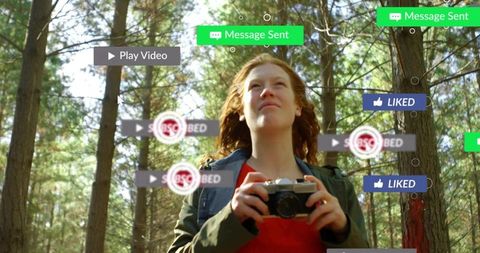 Young woman holding vintage camera in sunlit pine forest with ar social media overlays