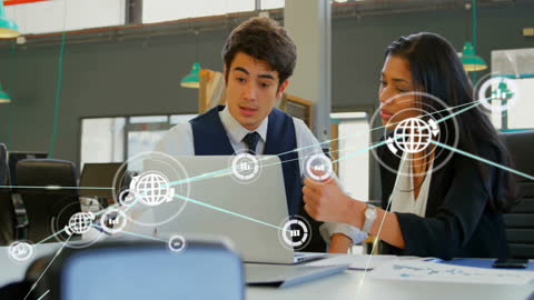 Colleagues Discussing Digital Network Strategy in Office