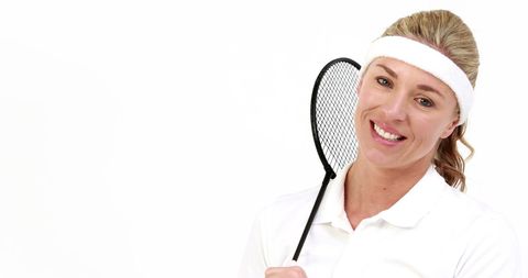 Smiling Female Tennis Player Holding Racket with Copy Space