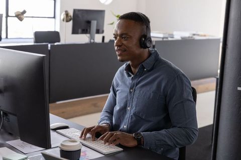 Positive professional collaborating in modern office
