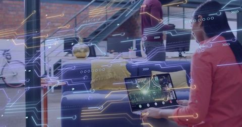 Woman Presenting Data on Laptop with Augmented Reality Overlays in Modern Office Lounge