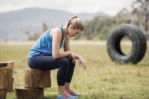 Woman Resting During Fitness Routine in Outdoor Setting - Download Free Stock Images Pikwizard.com