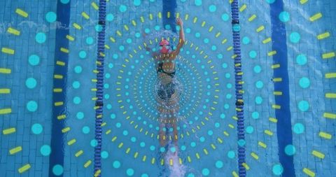 Mature swimmer gliding in lap pool with colorful concentric overlay, training focus