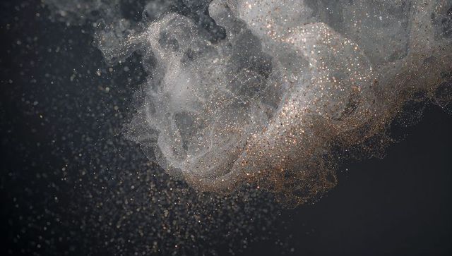 Swirling copper gold particle cloud with sheer filaments, sparkling metallic bokeh