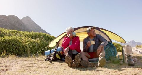 Senior Couple Enjoying Camping Retreat in Mountain Landscape