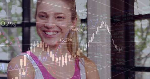 Smiling Woman Analyzing Financial Charts in Modern Studio