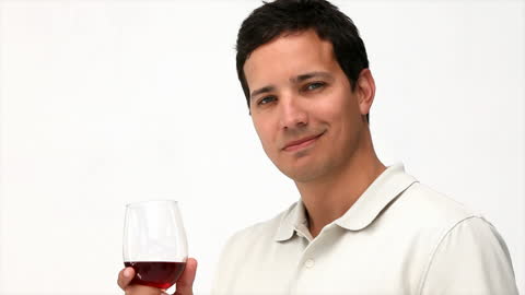 Man Enjoying Red Wine with Subtle Smile on White Background