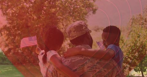 Soldier Embracing Family with Patriotic Pride Organically Outdoors