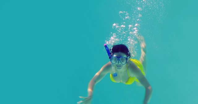 Woman Snorkeling in Tropical Ocean in Yellow Bikini - Download Free Stock Images Pikwizard.com