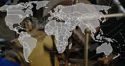 Global manufacturing network overlay translucent world map with industrial workshop hud