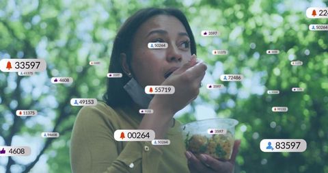 Young woman eating bowl outdoors with floating social media notification badges