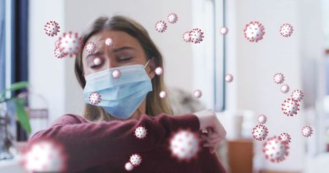 Woman coughing in office with mask and virus overlays