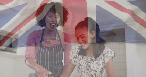 Mother and Daughter Cooking with Overlayed Union Jack Flag