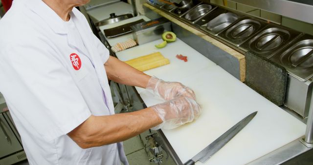 Sushi chef preparing food on kitchen counter - Download Free Stock Images Pikwizard.com