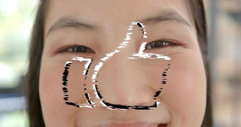 Closeup portrait korean woman smiling softly with thumbs-up overlay and natural makeup