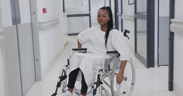 Young Woman in Wheelchair in Hospital Hallway - Download Free Stock Images Pikwizard.com