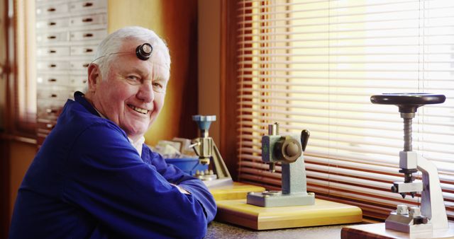 Senior Watchmaker Sitting at Workbench - Download Free Stock Images Pikwizard.com