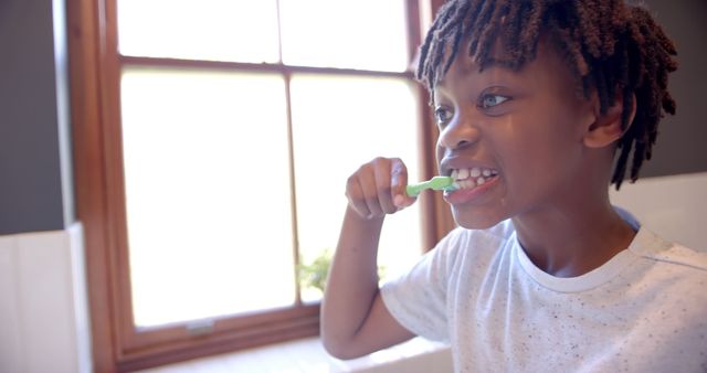 Young Boy Brushing Teeth in Bright Bathroom Morning Routine - Download Free Stock Images Pikwizard.com