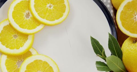 Sliced Lemons in Artistic Arrangement on Plate - Download Free Stock Images Pikwizard.com